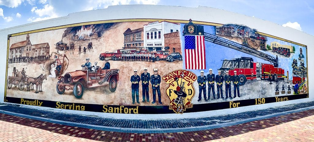 A mural on a wall honoring the proud history of the Sanford Fire Department