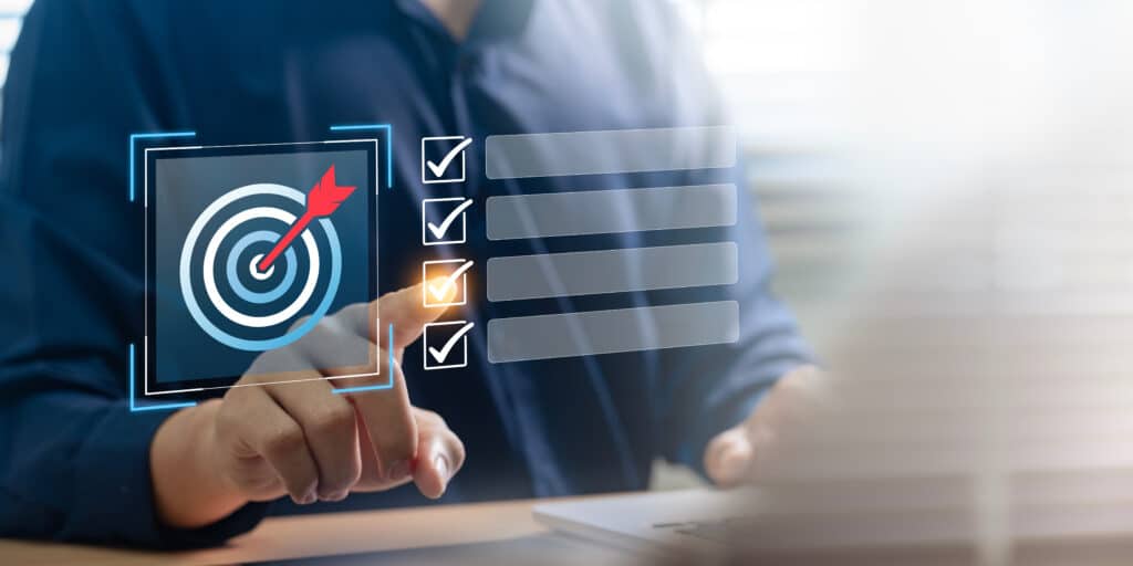 a man is checking off an item on the to-do list in the hopes of hitting a goal