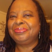 A woman smiles for the camera